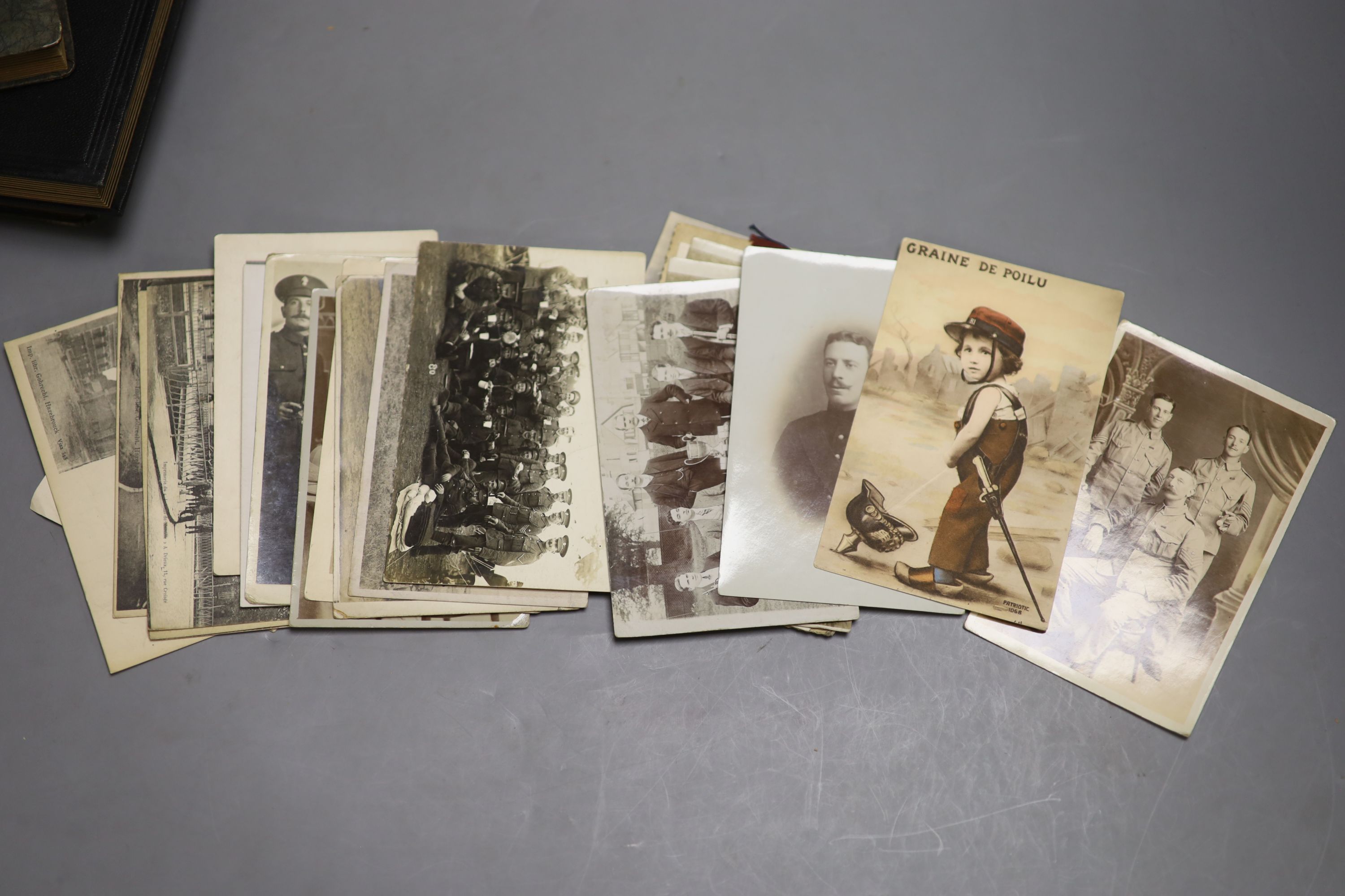 Three albums of photographs and a quantity of postcards inc. erotica.